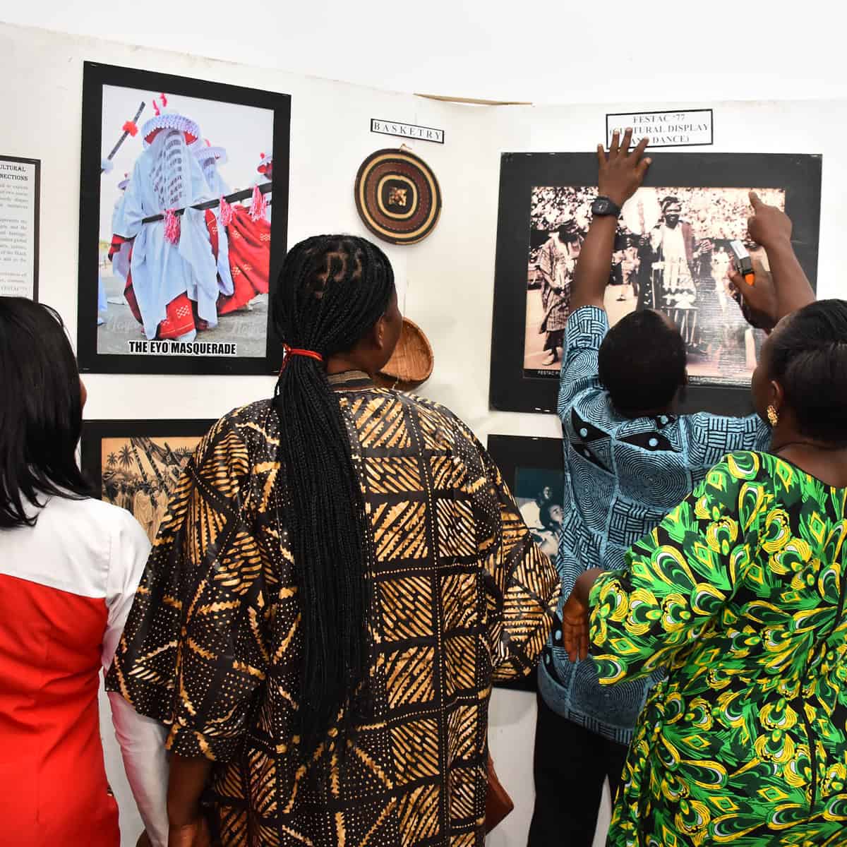 Guest photographing the display / cultural interlude