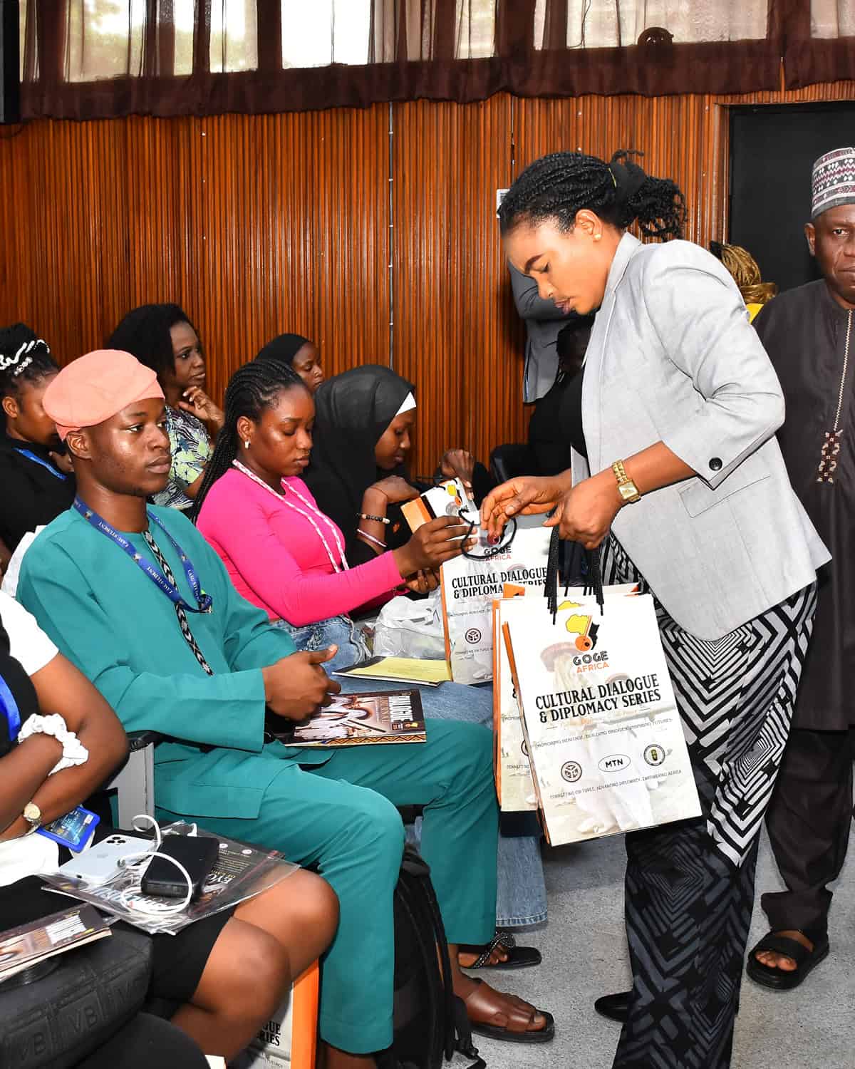Dignitary holding the White Lagos book